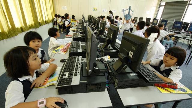 Children attending computer class