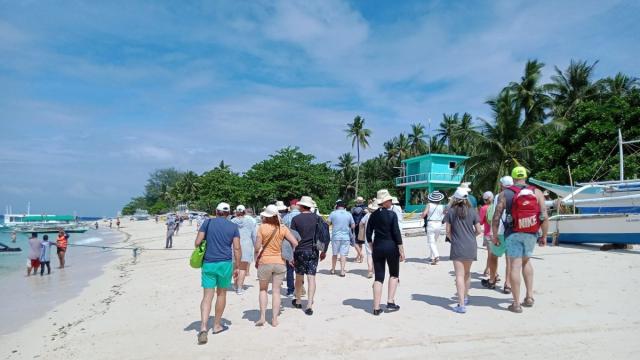 Passengers of a luxury cruise ship that visited two provinces in Mimaropa region. Photo credit: Philippine Information Agency.